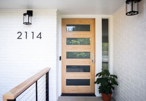 Scandinavian modern front door in natural wood tone