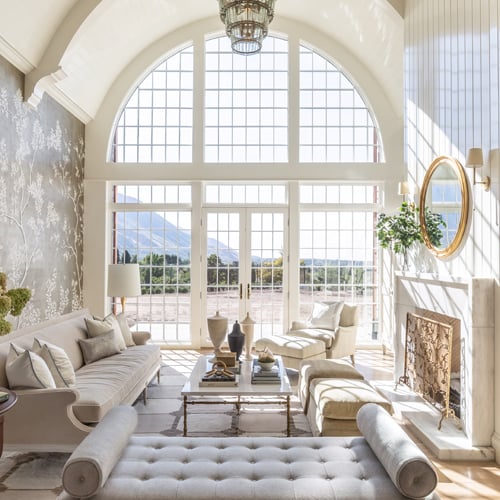 Elegant living space with hug window wall and doors with grilles