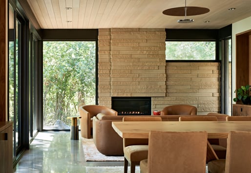 Mid-century modern living room with floor to ceiling picture windows